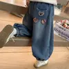 Estilo Novo de Inverno Calça Jeans com Forro de Pelúcia de Urso Xadrez para Crianças 2026 Estilo Coreano Calça Estilosa de Campus Estilo Pai para Meninas Roupas Infantis Tendência