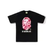Comercio exterior mayorista transfronterizo estilo japonés moderno estampado de camuflaje cabeza de tiburón cabeza de tigre mono bloques de color luminoso para pareja camiseta holgada morada