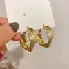 Pendientes de aguja de plata S925, nuevos y elegantes, con anillo trenzado, diseño de nicho de Corea del Sur, pendientes sencillos de moda que combinan con todo.