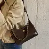 Bolsa de Ombro Acolchoada com Corrente de Luxo Feminina 2026 Nova Bolsa Hobo Versátil de Ombro Único Cruzada com Painéis Foscos