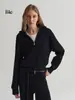Un cárdigan de punto práctico y elegante de manga larga con cuello alto y mangas raglán, perfecto para mujeres en otoño, con un diseño de doble cremallera
