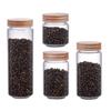 Frasco de vidrio de borosilicato de alta calidad para almacenar té, café y productos secos. Botella transparente sellada con tapa de haya roscada. Múltiples especificaciones.