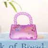Bolso de mano de frutas Little Red Book transfronterizo, juguete de apretar con jarabe de malta para alivio del estrés y juguete de descompresión de rebote lento, venta al por mayor