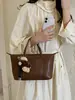 Colección nueva Otoño 2026: bolso de mano casual versátil con un look sofisticado, diseño simple, perfecto para ir al trabajo, y un bolso de hombro de moda, de nicho para mujer
