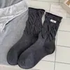 Calcetines de estilo ballet otoño/invierno estilo ins coreano puño suelto borde enrollado longitud hasta media pantorrilla adelgazantes tela de felpa JK etiqueta de tela estilo academia de huevo calcetines largos