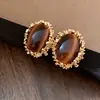 Pendientes de borla con carcasa de madera marrón transfronterizos europeos y americanos, pendientes de estilo vintage Maillard, pendientes de mujer de lujo ligero de alta gama
