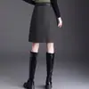 Saia de Lã Elegante Linha A Feminina 2026 Outono/Inverno Nova Cintura Alta Emagrecedora Curta Saia de Temperamento para o Trabalho Justa ao Corpo