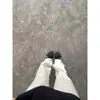 En stock Jeans blancos retro americanos para hombre y mujer verano tendencia marca básica color liso pierna recta pantalones holgados