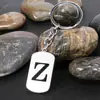 Novo Anel de Chaveiro Aço Inoxidável Brilhante 26 Letras Inglesas Pendurado Vintage Pequeno Presente Pingente de Chaveiro
