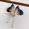 Aretes de Mariposa Bordada Etereos con Circonia y Perla 2026 Nuevos Aretes Estilo Pastoral Dulce Joyería de Oreja de Alta Gama