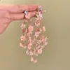 Pendientes de flores de colores 2025, nuevos diseños de nicho con un temperamento avanzado y personalidad única y exagerada para mujeres.