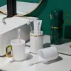 Taza multifuncional para cepillo de dientes de viaje, una caja de almacenamiento de cepillo de dientes y pasta de dientes lujosa y portátil, un juego de artículos de tocador de viaje tres en uno