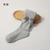 Colección de primavera y otoño transfronteriza: Leggings infantiles con diseño estilo princesa, versátiles para usar como prenda exterior, con rayas verticales y un gran moño, adecuados para niñas