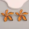 Europa y Estados Unidos nueva moda personalidad temperamento creativo transfronterizo pendientes de flor de aceite pendientes exagerados de punto de onda de aleación para mujeres