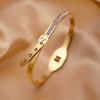 Pulsera de acero inoxidable y acero de titanio, tendencia explosiva, no se decolora, chapado al vacío 18K, lujo ligero, simple