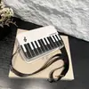 Bolsa Transversal Criativa de Ombro Piano 2026 Nova Coleção de Primavera Versátil Estilosa Bolsa de Ombro Único com um Toque Criativo para Mulheres