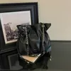 Bolsos transfronterizos de moda 2026 nuevos bolsos de hombro con cadena otoño/invierno bolsos cruzados tipo cubo de moda nicho
