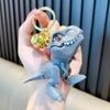 Celebridade online Tiranossauro mordendo brinquedo chaveiro criativo dinossauro pequeno pingente casal mochila pingente pequeno presente atacado