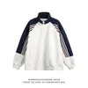 Colección de otoño nueva transfronteriza: Cárdigan de retazos de color block de moda con cuello alto, una chaqueta retro, holgada y deportiva para parejas
