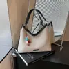 Bolso tipo cubo retro casual de gran capacidad estilo coreano para mujer, nuevo bolso de hombro y bandolera simple de moda para verano 2026