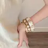 Set vintage de pulseras apilables doradas para mujer, estilo bohemio vacacional, pulseras de declaración de nicho, joyería exagerada