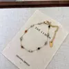 2026 Novo Popular Pulseira Sorriso Flor de Glicínia para Mulheres, Luxo Leve Nicho Exquisito Cristal Pulseira de Alta Qualidade Presente para Melhor Amiga