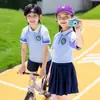 Uniforme Escolar de Jardín de Infancia de Fábrica Conjunto Donación de Bienestar Público Personalización de Uniforme Escolar Se Puede Imprimir LOGOTIPO Ropa de Amor para Niños de Zona Montañosa Soldado