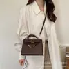 Nuevo bolso Kelly transfronterizo de gran capacidad con estampado de lichi, bolso de mano de moda para el trabajo, bolso cruzado de color sólido con hebilla de bloqueo