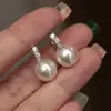 Pendientes Geométricos de Perla Brillante Cao Shi, Joyería Elegante y Suave, Incrustados con Circonita, Populares Diarios Taobao