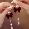 Brincos de Pérola com Laço Vermelho para Outono e Inverno Brincos de Luxo Femininos 2025 Novo Estilo Chinês Brincos Vermelhos