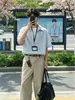 Suéter de dos piezas falsas estilo americano con cuello de solapa, camisa de manga corta a rayas para hombre, camisa casual versátil unisex estilo japonés