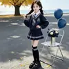 Conjunto JK para Meninas Outono Novo Estilo Crianças Pequenas e Grandes Estilo Escolar Hoodie Falso de Duas Peças Saia Plissada Conjunto de Duas Peças Roupa de Estudante