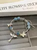 Pulsera de Diseño Nicho Flor Espiritual Galaxia Impresión Li Muwan Estilo Chino Super Valor, Joyería de Amistad de Gama Alta y Estéticamente Agradable Regalo