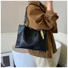 Bolsa de nicho da moda para mulheres, novo modelo 2026, casual versátil com toque de luxo, bolsa de ombro e transversal versátil, moderna