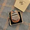 Instrumento Musical al por Mayor 8 Tonos Mini Piano de Pulgar Piano de Dedo Kalimba Madera Maciza Cristal Piano de Cinco Dedos Portátil Instrumento Musical para Niños