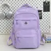 Mochila Escolar Grande Capacidade Estudante 2025 Novo Estilo Simples Tecido de Nylon Repelente à Água Mochila Casual de Viagem Mochila Feminina
