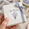 Pegatina de papel con veta de madera gracias en stock pegatina de sellado embalaje de caja de regalo tulipán azul decoración simple