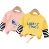 Camiseta de manga larga para niños, top de otoño, nuevo modelo 2026 para niños, algodón puro, estilo primavera y otoño, patchwork a rayas, imitación de dos piezas