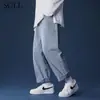 Jeans bordado masculino primavera ins alta rua solto calça masculina primavera e outono marca de moda reta perna larga calça americana