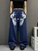 Calça de moletom niche estilo casual americano com estampa de asa e estrela em blocos de cor, calça de moletom azul solta e fluida, calça de dança jazz