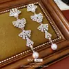 Brincos de Pérola com Borla de Laço Incrustada com Diamante e Agulha de Prata Retrô Francês Exquisitos Versáteis Luxo Acessível Brincos de Alta Qualidade