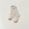 Nuevos calcetines de primavera para niñas, calcetines de algodón peinado antipelusa de caña media, calcetines con borde de volantes de doble costura, al por mayor