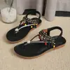 Sandalias planas de estilo étnico bohemio para mujer, moda de verano 2026, chanclas con pedrería y tira elástica para mujer