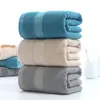 Envío gratis toalla de baño de algodón engrosada venta directa de fábrica toalla de baño de algodón para el hogar toalla de playa para parejas logo bordado