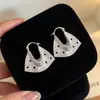 Elegante HerederaEstilo Fresco Bolso de Lunares Plateados Arete Arete Único Mujer 2026 Aretes Súper Hermosos