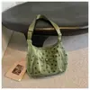 Bolsa de Lona Feminina Outono Inverno 2026 Nova Pequena Design de Nicho Bolsa de Ombro Único Transversal Estilo Coreano Casual Popular Este Ano Bolsa Tote