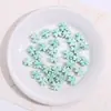 Verano Nuevo Cerámica Trébol de Cuatro Hojas Agujero Recto para Ensartar Pulsera Collar DIY Hecho a Mano Accesorios de Joyería Materiales Cuentas Sueltas