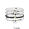 Moda Transfronteriza Europea y Americana Estilo Personalidad Amor Blanco y Negro Cuentas de Arroz Cuentas Doradas Elástico Pulsera para Mujer Juego de Cuatro Piezas