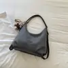 2026 Bolso de Axila con Textura Tejida Nuevo Personalidad Elegante Color Sólido Retro Alta Apariencia Bolso Tote de Hombro Único para el Trabajo y el Trayecto