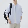 Camisa de manga larga 2026 moda primavera y otoño camisa de rayas para hombre chaqueta casual holgada versátil top chaqueta